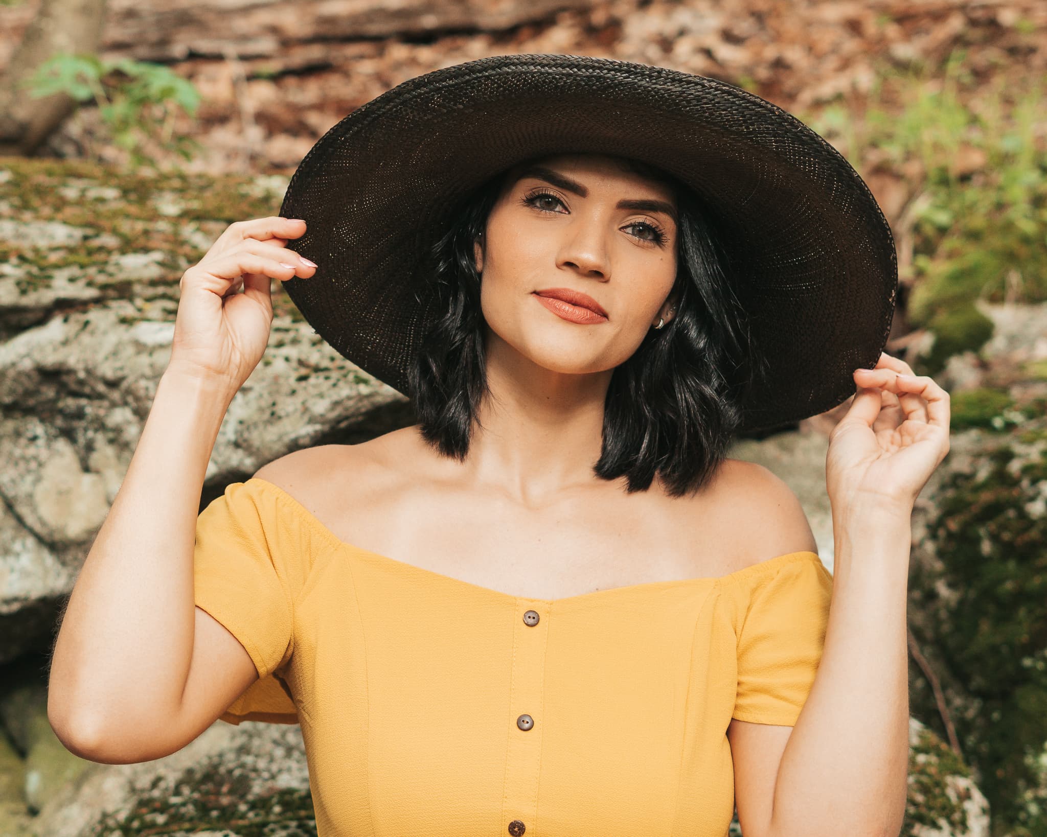 Woman in yellow dress and wide brim hat
